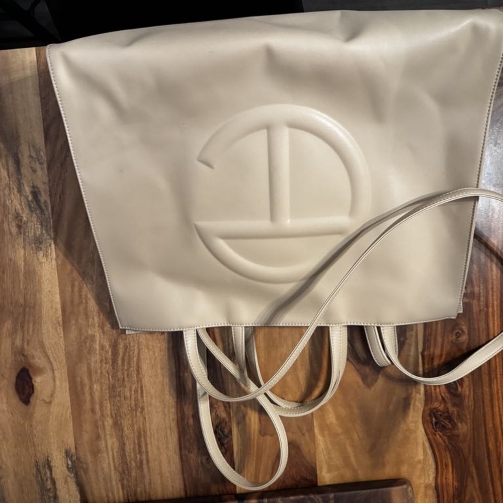 Cream Shoulder Bag with Textured Material and Embossed Logo